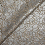Silver laminated cotton guipure on an ecru background
