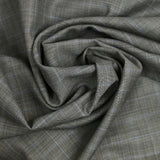 100% Prince of Wales wool suit fabric, black, blue, off-white background