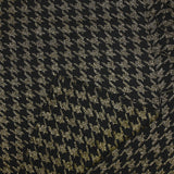 Gold houndstooth wool blend tweed on black background