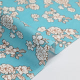 Off-white spring printed viscose with azurin blue background
