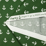 Cotton printed with white navy anchor, forest green background
