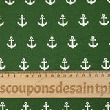 Cotton printed with white navy anchor, forest green background