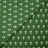 Cotton printed with white navy anchor, forest green background