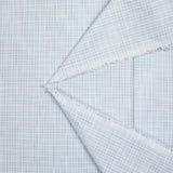 Polycotton poplin with brown checks and sky blue background