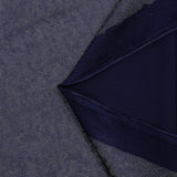 Jersey printed with holographic silver polka dots, navy blue background