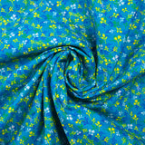 Cotton poplin printed yellow and blue bud with turquoise background