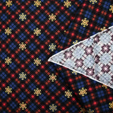 Cotton flannel printed with brown tartan and gold flakes