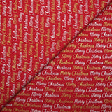 Popeline de coton imprimée Merry Christmas doré et argent fond rouge