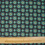 Cotton corduroy printed with turquoise rosettes and brown background