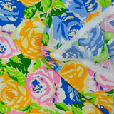 Viscose printed mountain of orange, blue and green flowers