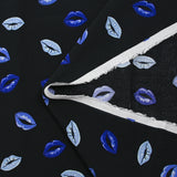 Viscose crepe printed with blue mouth and black background