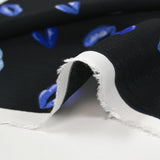 Viscose crepe printed with blue mouth and black background