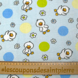 Polaire doudou imprimée fleurs et canetons fond bleu ciel