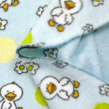 Polaire doudou imprimée fleurs et canetons fond bleu ciel