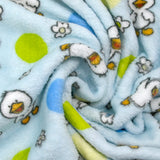 Polaire doudou imprimée fleurs et canetons fond bleu ciel