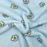 Polaire doudou imprimée fleurs et canetons fond bleu ciel