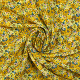 Crepe georgette estampado con pato y flores amarillas
