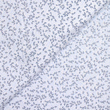 Polycotton poplin printed with navy grove and white sky background