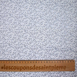 Polycotton poplin printed with navy grove and white sky background