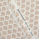 Coated poplin with beige vegetable print on off-white background