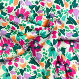 Coton imprimé Martina fleurs fantaisie fuchsia et vert au mètre