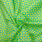 Popeline enduite imprimée champs de fleurs vert fond citron