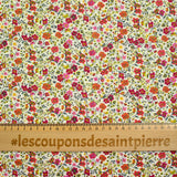 Coton imprimé Greta fleurs fuchsia et orange fond blanc au mètre