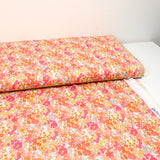 Coton imprimé Matilde fleurs mandarine et rose au mètre