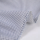 Popeline polycoton imprimée croisillons marine fond blanc