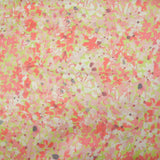 Silk satin printed with coral pink flowers on a pastel green background