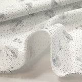 Cotton piqué with hedgehog print and blue polka dots on white background