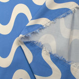 Viscose satin printed with ecru waves and sky background