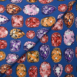 Viscose crepe with precious stone print, royal blue background