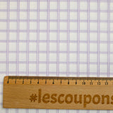 Dyed-woven cotton poplin with purple checks on white background
