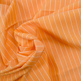 Striped dyed-woven cotton poplin with papaya background