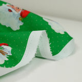 Santa Claus printed cotton with green polka dots