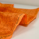 Printed cotton with dark orange background