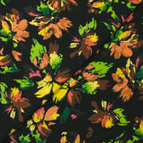 Viscose printed with squiggles of flowers on a black background
