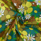 Algodón con estampado de flores disco turquesa, marrón y amarillo mantequilla