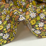 Cotton printed meadow in flowers yellow dark brown background
