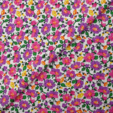 Cotton poplin printed mist of purple and pink flowers on white background