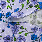 Cotton poplin printed climbing flowers with purple polka dot background