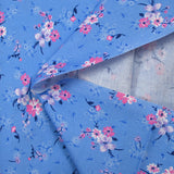 Cotton poplin printed bouquet in the clouds cornflower blue background