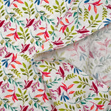 Cotton poplin printed with colorful foliage on white background