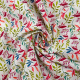 Cotton poplin printed with colorful foliage on white background