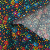 Cotton poplin printed with embroidered flowers on a midnight blue background