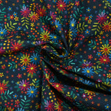 Cotton poplin printed with embroidered flowers on a midnight blue background