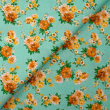 Cotton poplin printed with orange bouquet on a water green background