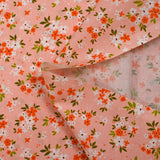 Cotton poplin printed floral composition peach pink background