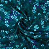 Cotton poplin printed with turquoise flowers on a dark blue background